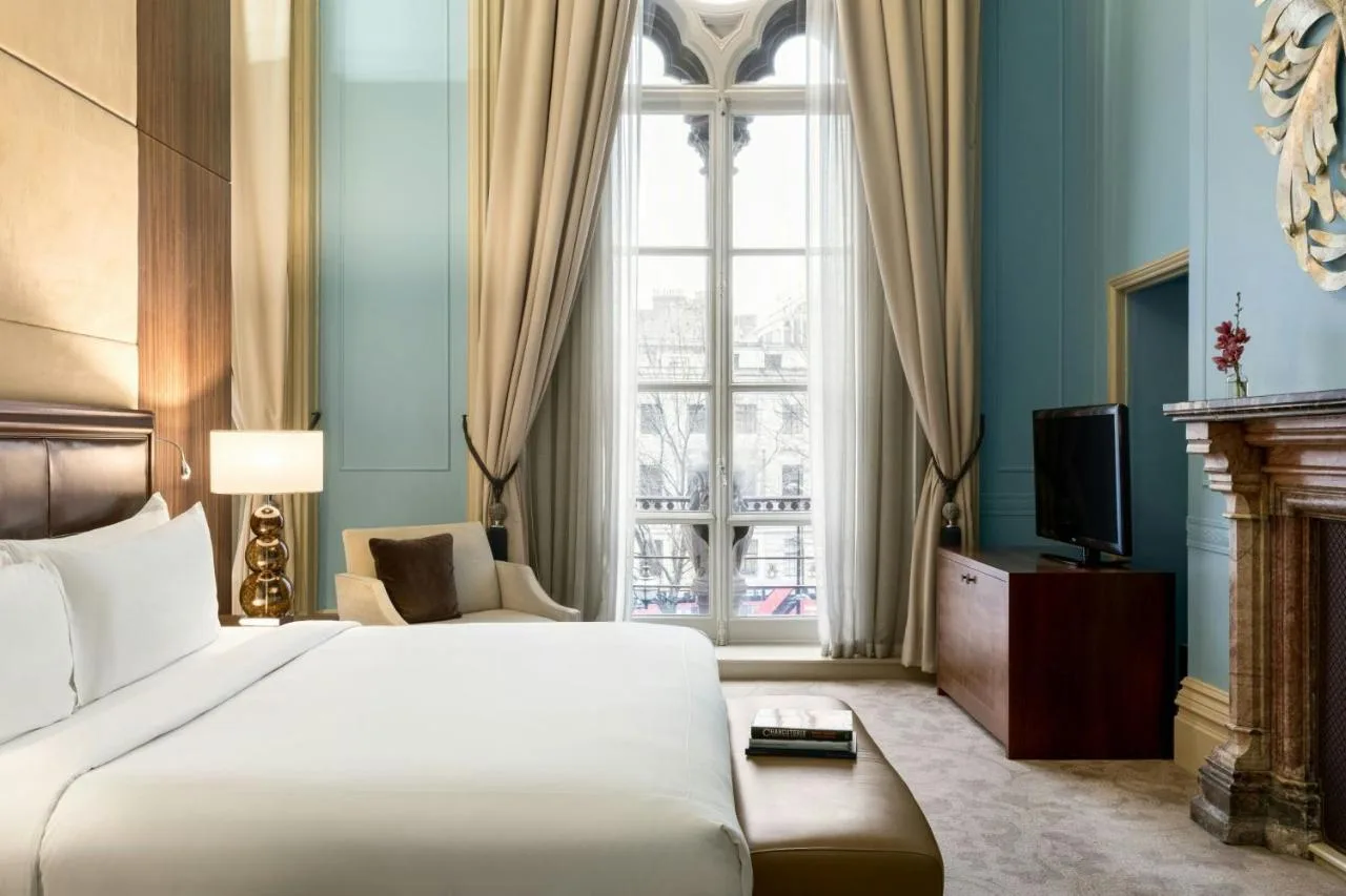 a hotel room with a bed and a window at St Pancras London, Autograph Collection